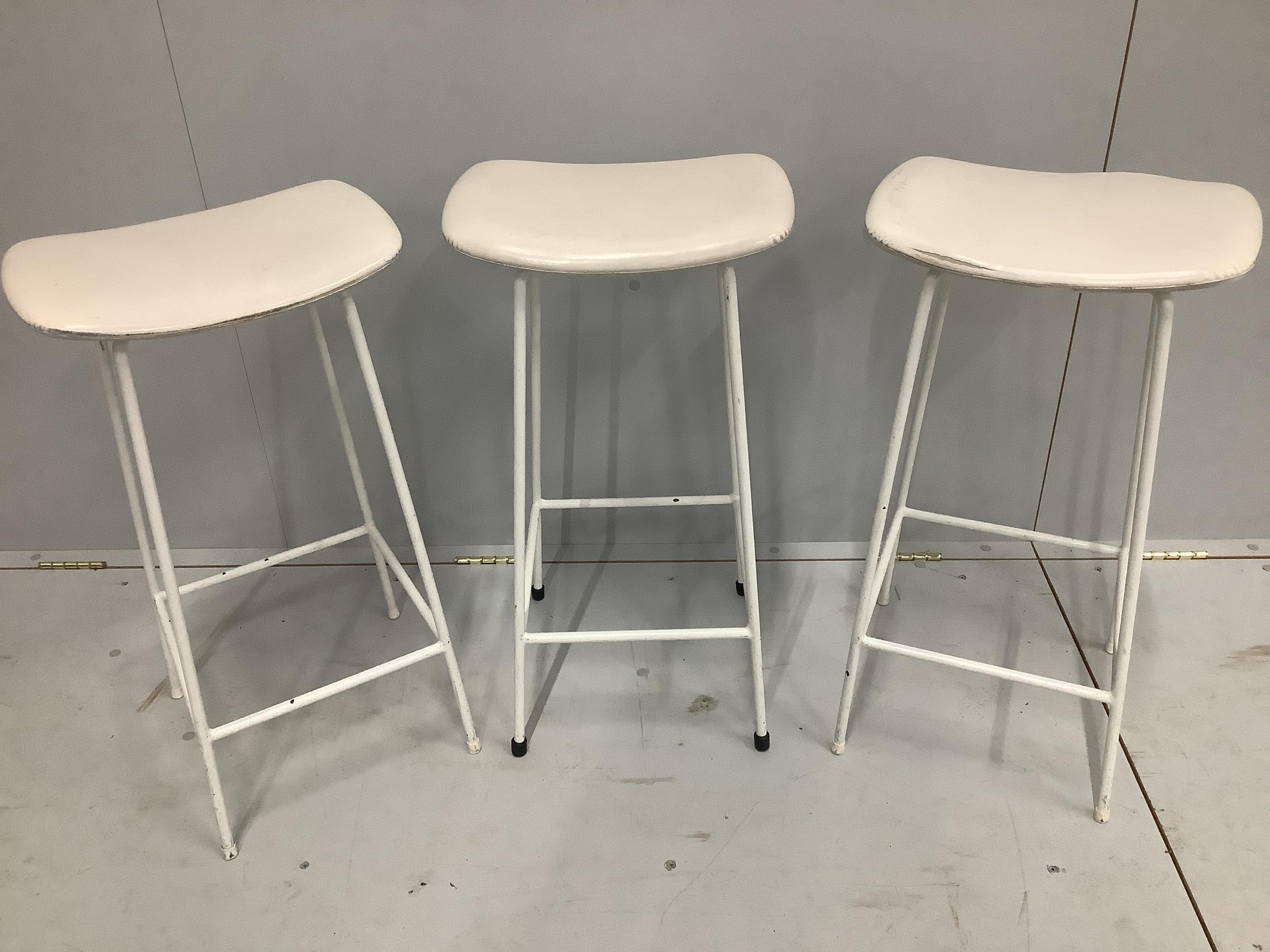 A set of three 'Program' white enamelled stools by Frank Guille for Kandya, height 70cm